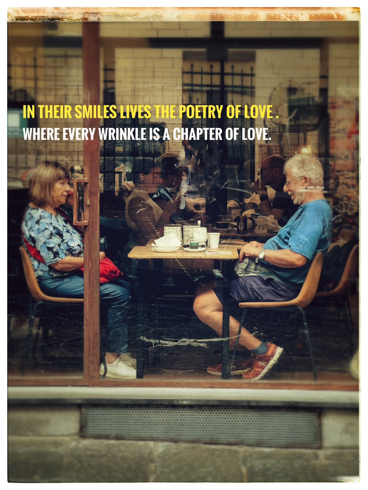 A couple at a café table; the image carries an overlaid love-themed quote.